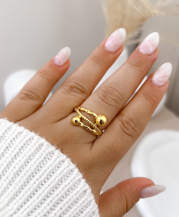 Crossed ring with pellets